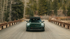 Porsche 992 911 Dakar in Green on a bridge